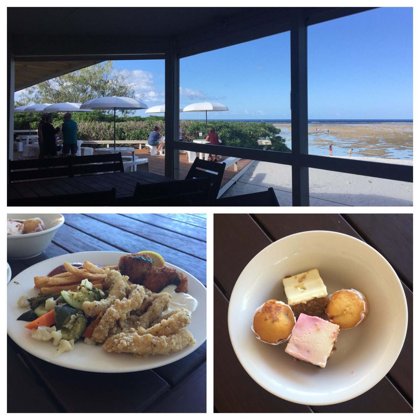 Two plates of food on a table overlooking the beach